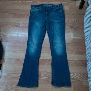 Dark blue jeans with cute decorations of wings on back boot cut